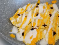 Ravioli alla zucca con crema di parmigiano reggiano Dop e aceto balsamico di Modena Igp